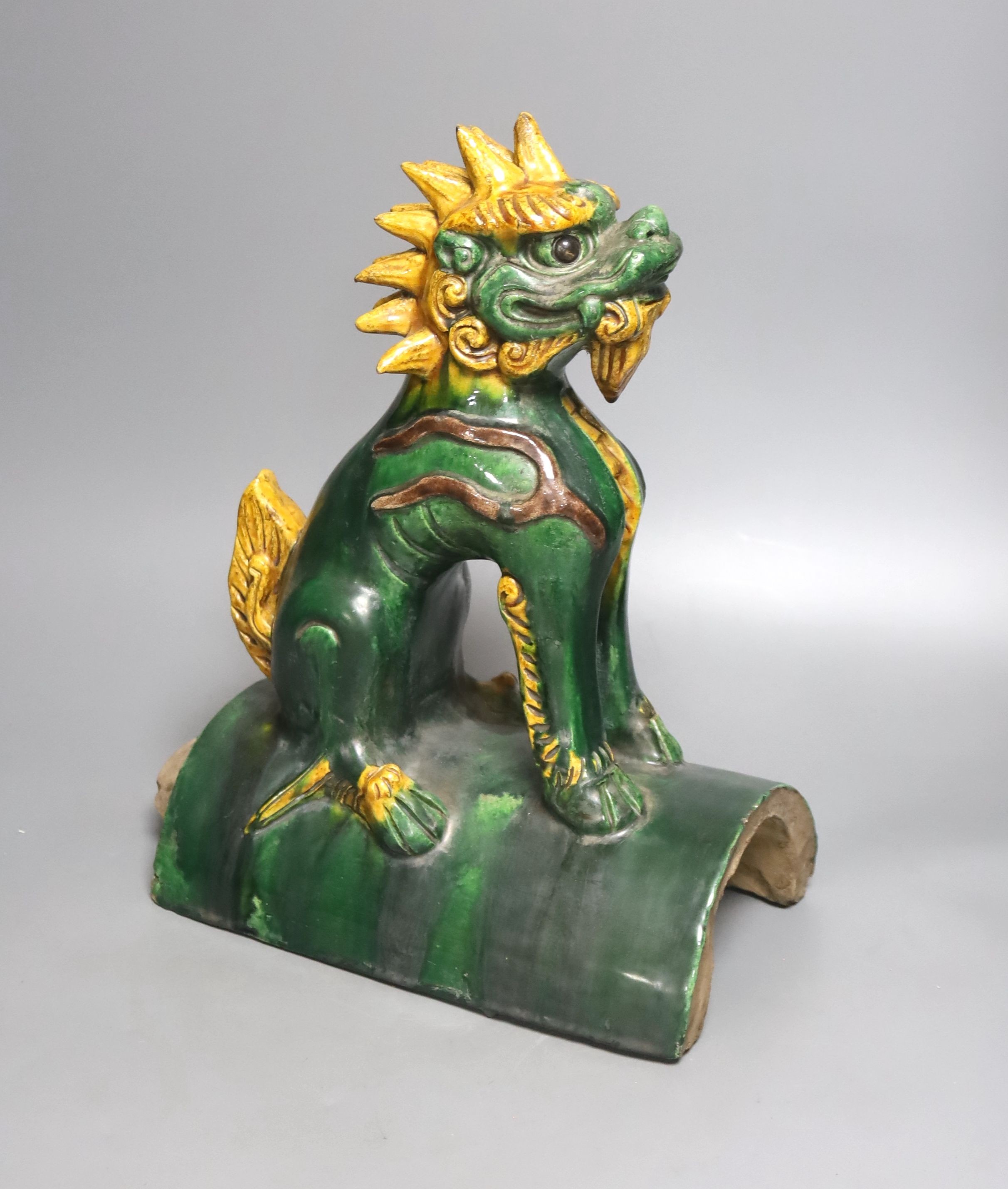 A Chinese pottery ‘lion dog’ ridge tile 33cm